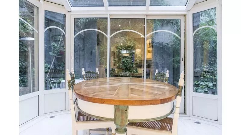 Cozy Parisian style apartment with a veranda overlooking a private garden.