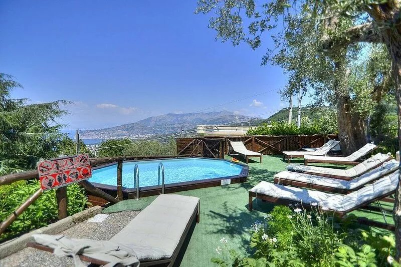 Villa Silene: A welcoming three-story villa located on a hillside, facing the