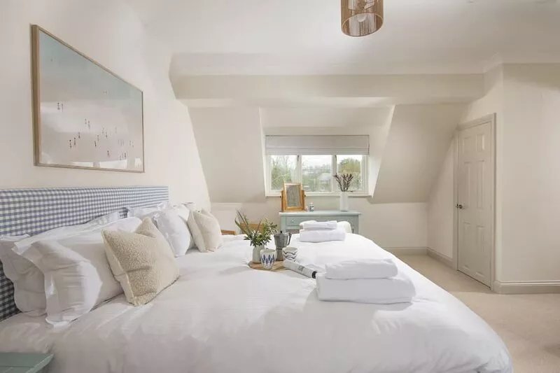 The Nineteenth is a traditional four bedroom house overlooking Roserrow lakes.
