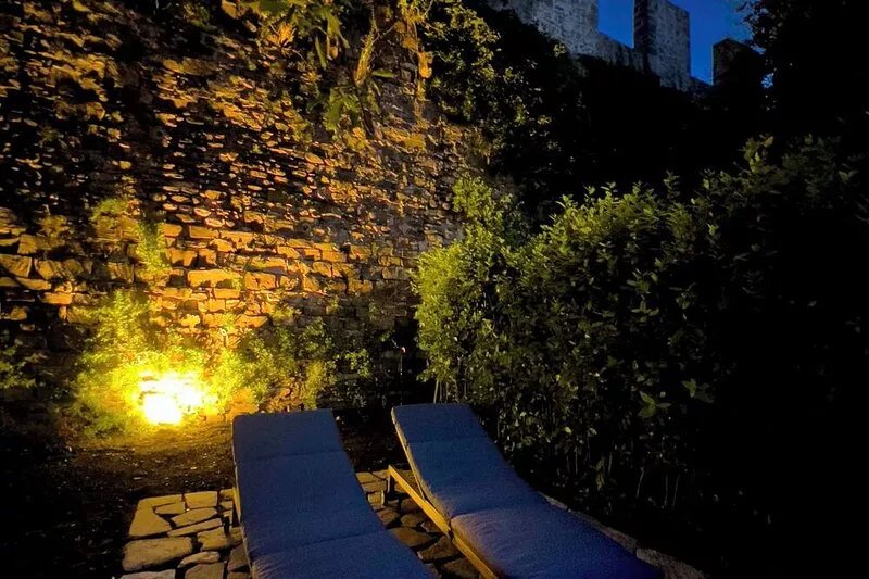 Top floor with garden bordering the historic city walls in San Niccolò district.