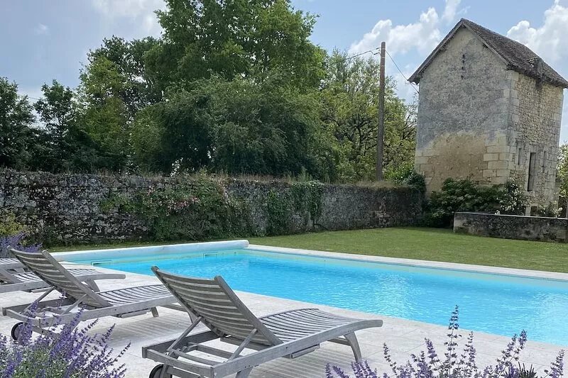 Spacious holiday home with a pool surrounded by vineyards