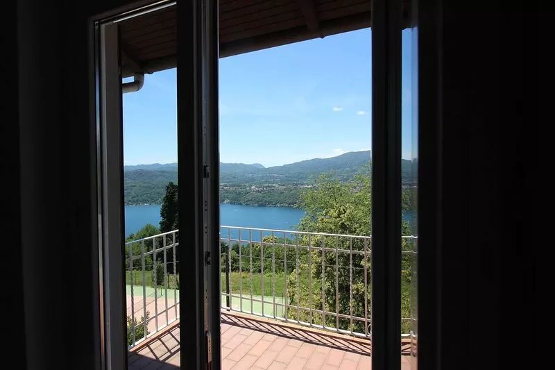 Overlooking Lake Orta. Plenty of room, private garden with pool