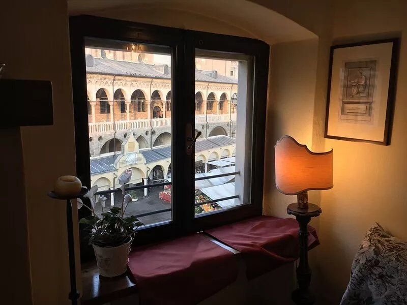 Elegant two-story apartment with windows overlooking the Palace of Reason.