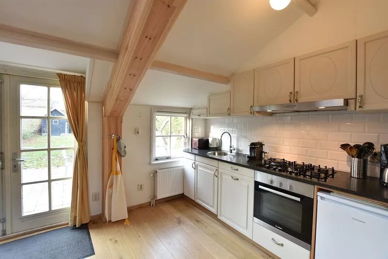 Warmly decorated holiday home with wonderful garden near the beach.